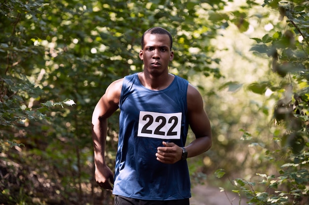 Athletic man participating in a cross country