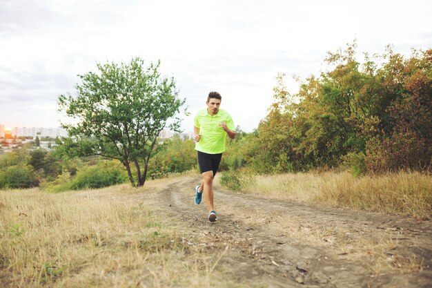 Athletic man running in the park