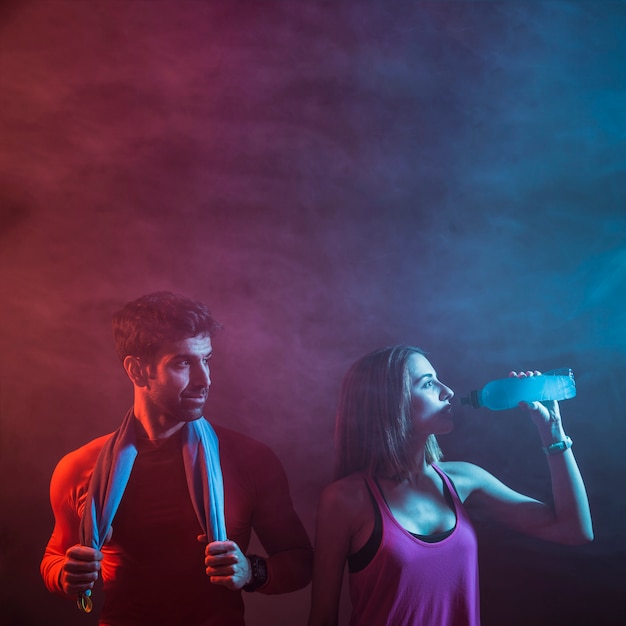 Athletic sportspeople posing in studio