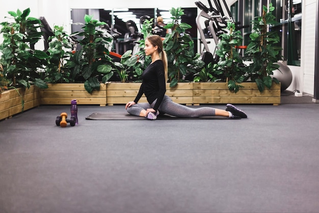 Athletic woman doing exercise in gym