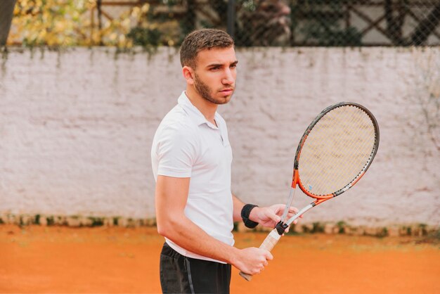 Athletic young boy playing tennis