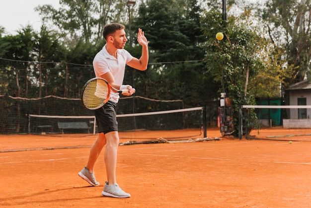 Athletic young boy playing tennis