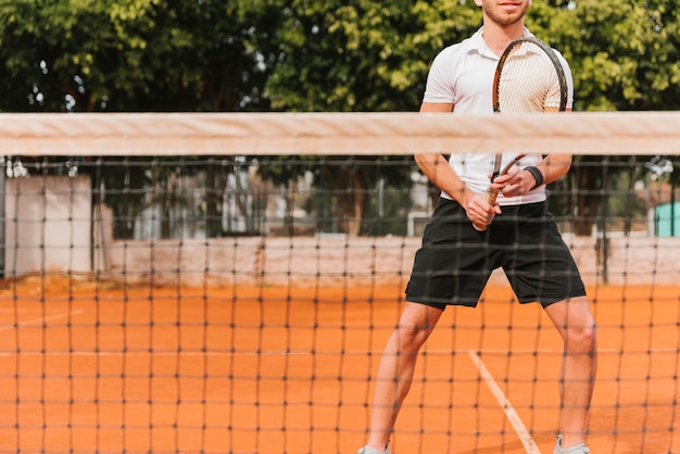 Athletic young boy playing tennis