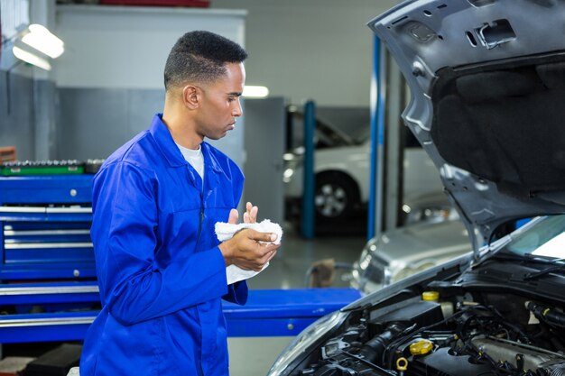 Attentive mechanic servicing car