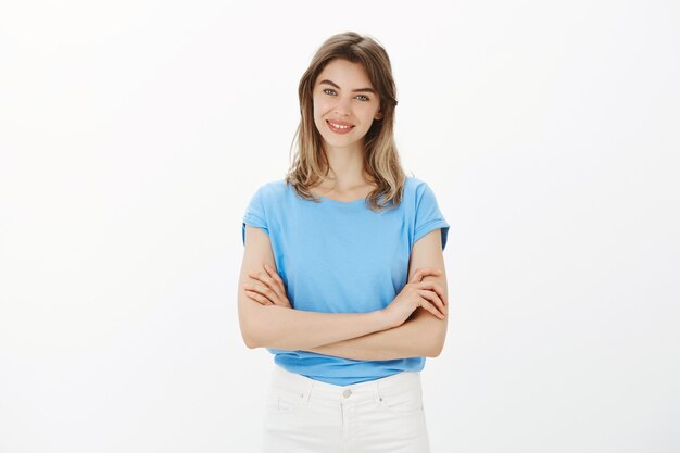 Attractive adult woman cross arms chest and smiling confident