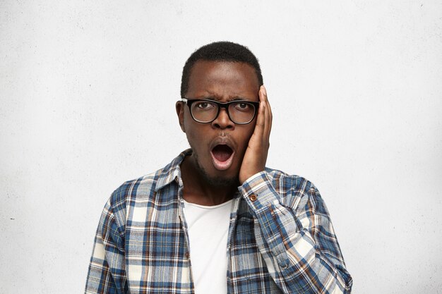 Attractive Afro-American man shocked and upset