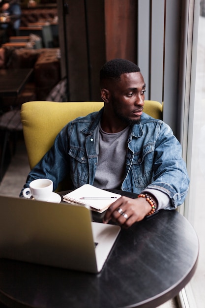 Attractive afroamerican male looking away