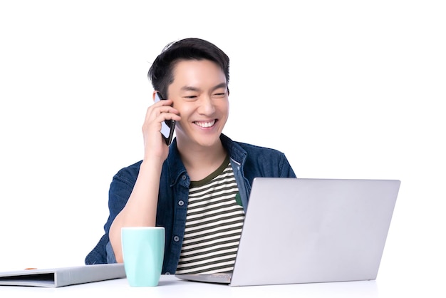 Attractive asian entrepreneur working with laptop smartphone with confident and cheerful isolate white background