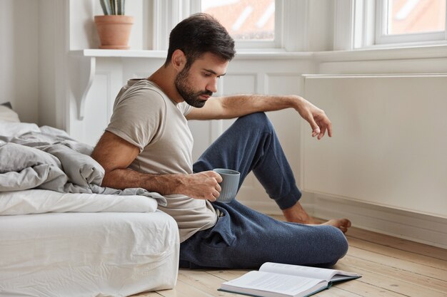 attractive bearded guy posing at home while working