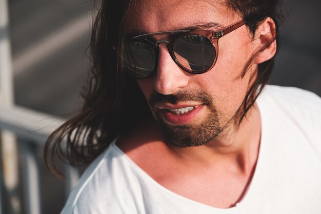 Attractive bearded man portrait wearing fashionable sunglasses