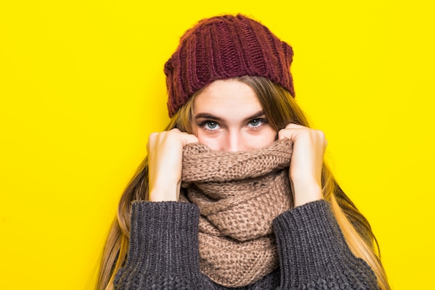 Free photo attractive blonde woman in warm sweater is ill flu cold and try to warm up