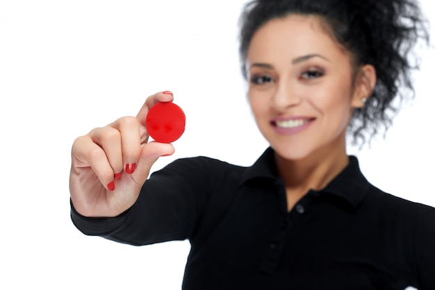 Attractive brunette holding casino tokens