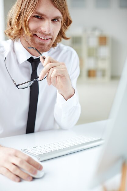 Attractive businessman using the computer