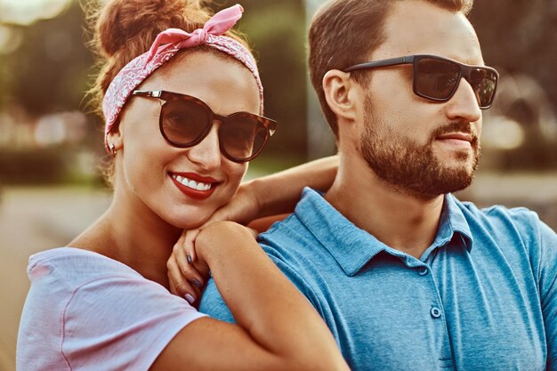 Attractive couple enjoying rest in the park. Happy middle age couple during dating outdoors.