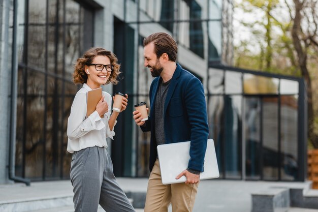 Attractive couple of man and woman talking in urban city center