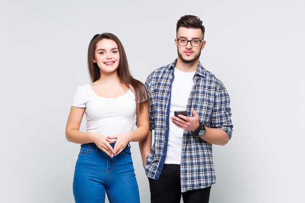 Attractive delightful woman in denim clothes and causasian smiling man in jeans