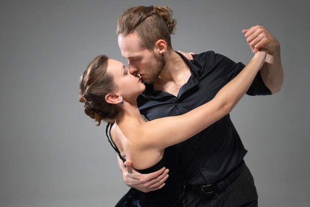 Attractive elegant people dancing tango