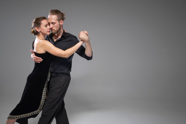 attractive elegant people dancing tango