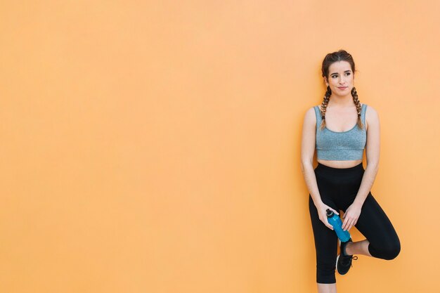 Attractive fit woman with blue drink