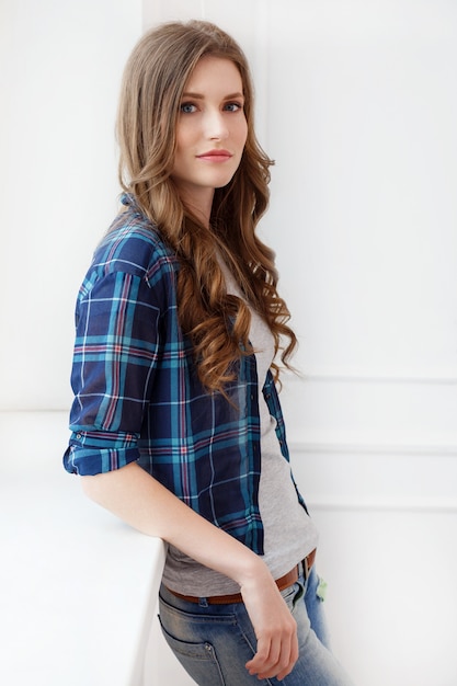 Attractive girl by the window