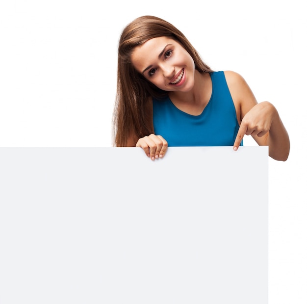 Attractive girl holding a blank sign