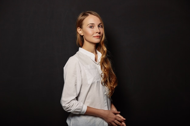 Attractive girl portrait in a white shirt