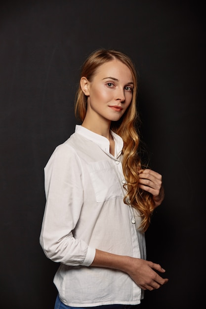 Attractive girl portrait in a white shirt