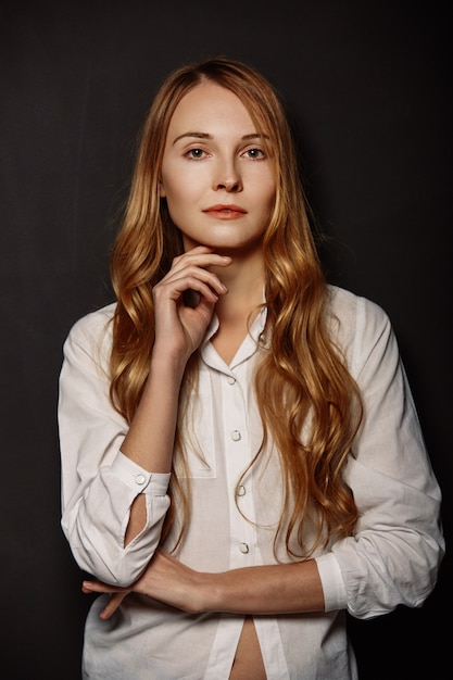 Attractive girl portrait in a white shirt