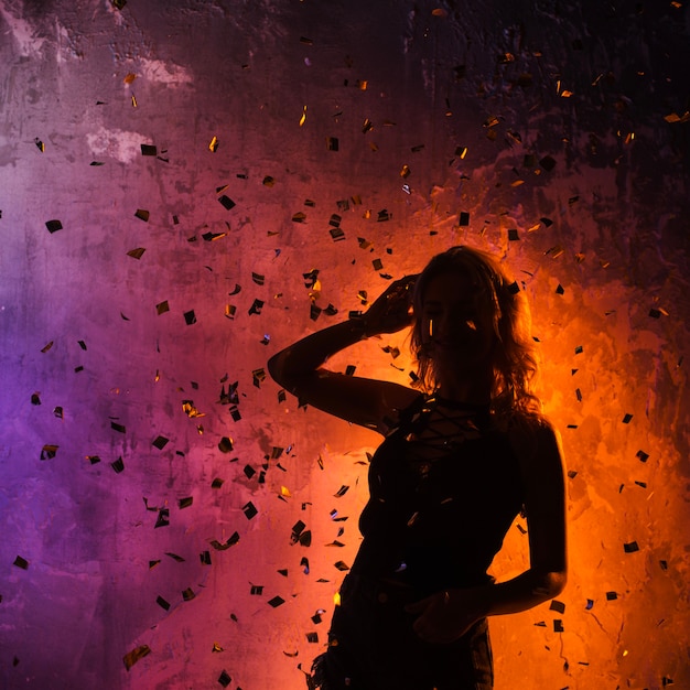 Attractive girl silhouette in confetti