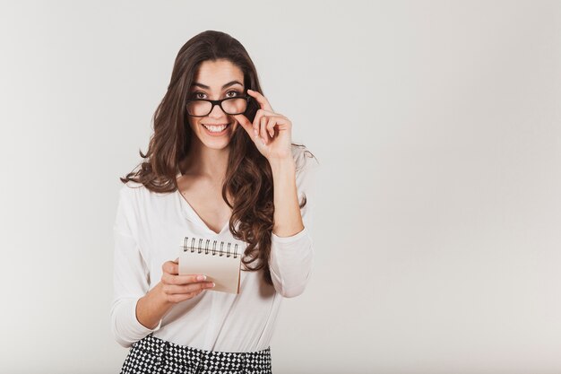 Attractive girl touching her glasses