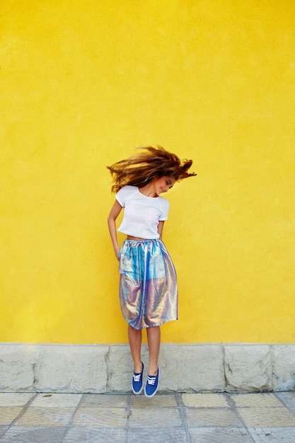 Attractive girl in an unusual skirt