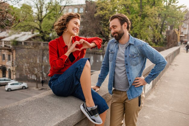 Attractive happy smiling man and woman traveling together