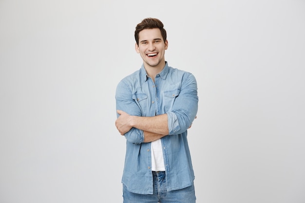 Free photo attractive laughing guy having fun, smiling happy