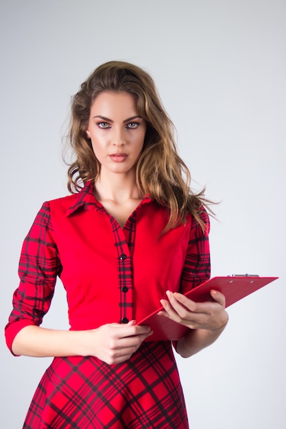 Attractive modern young Business woman with clipboard