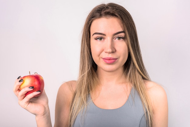 Attractive positive lady with apple