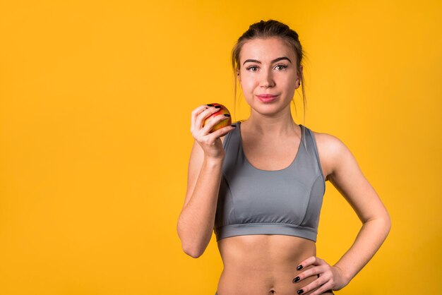 Attractive positive woman with fruit