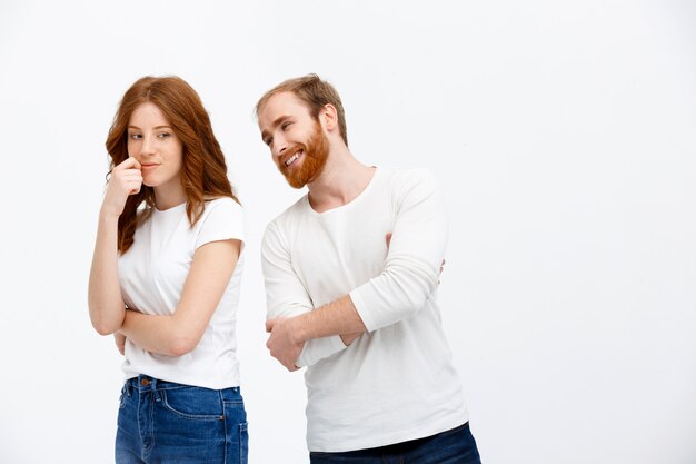 Attractive redhead man and woman talking