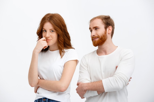 Attractive redhead man and woman talking