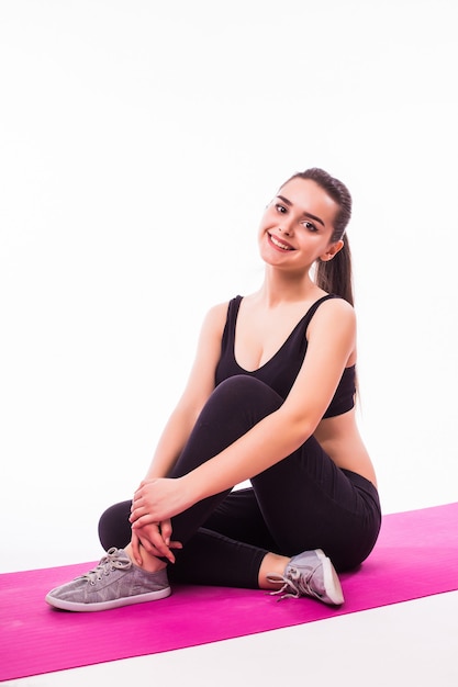 Attractive sporty woman exercising isolated on white background