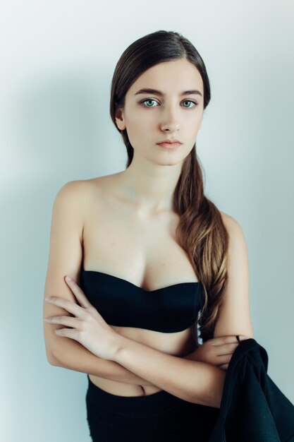 Attractive teenager posing with crossed arms