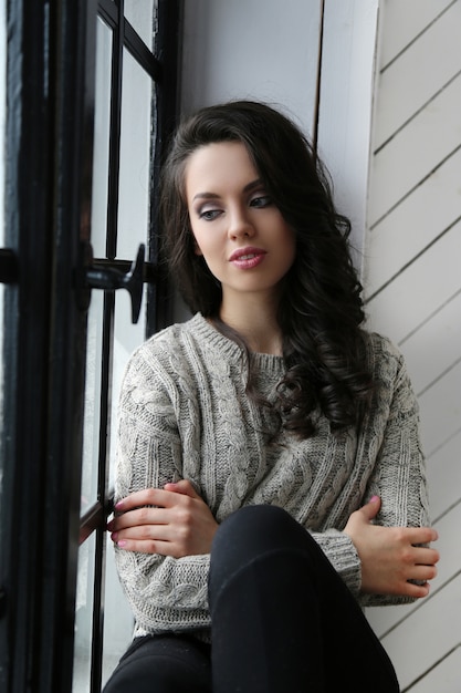 Attractive woman looking out the window