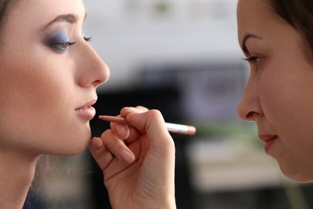 Attractive woman during makeup