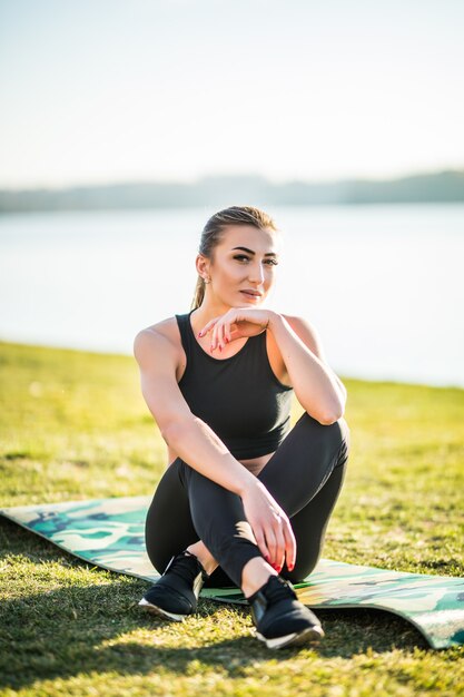 Attractive woman stretching before Fitness and Exercise relax on mat