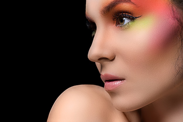 Free photo attractive woman with colored make-up