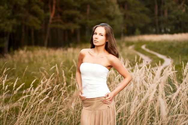 Attractive woman with hands on waist