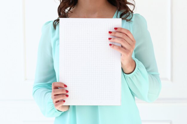 Attractive woman with notepad