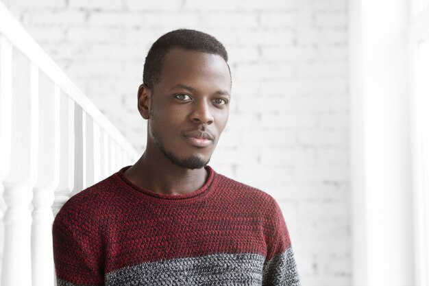 Attractive young African American male dressed casually looking at camera