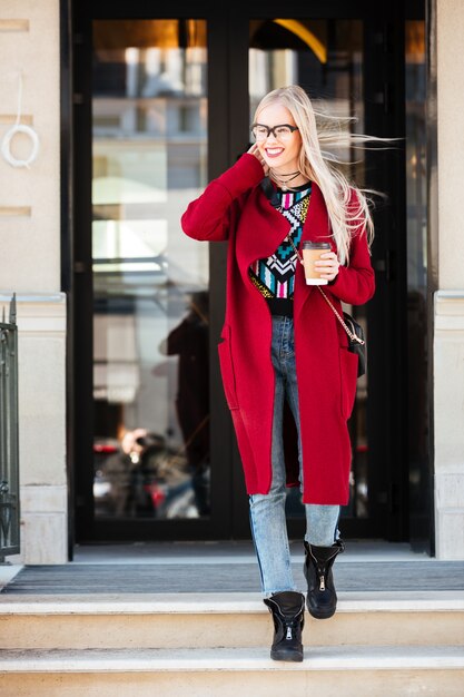 Attractive young caucasian woman walking outdoors.