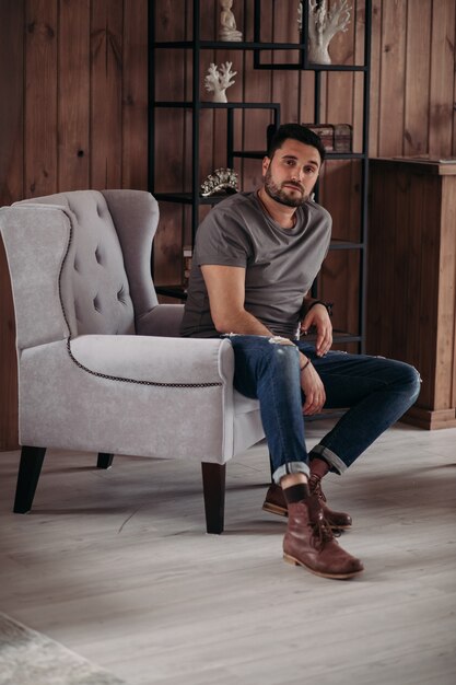 Attractive young man is relaxing at home