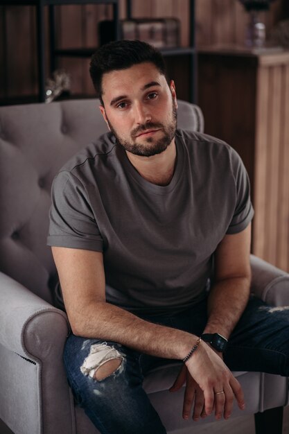 Attractive young man is relaxing at home